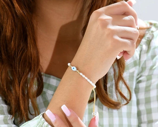 Bracelet « eye »  perle naturel avec boules d’Or 18 carats ✔️